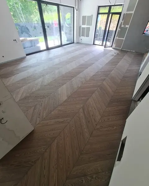 Chevron in a room with a glass wall onto the garden