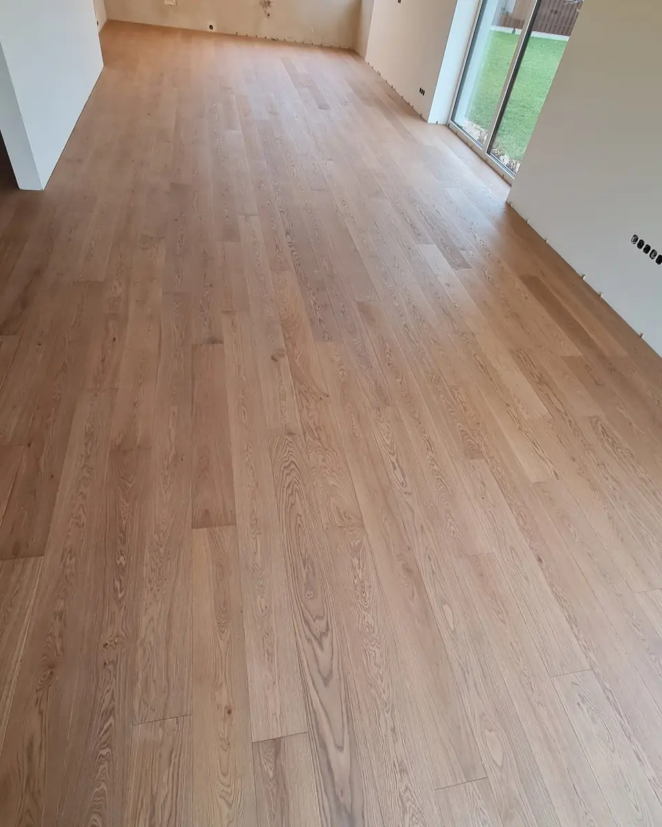 Oak boards with a sharp band of sunlight across them
