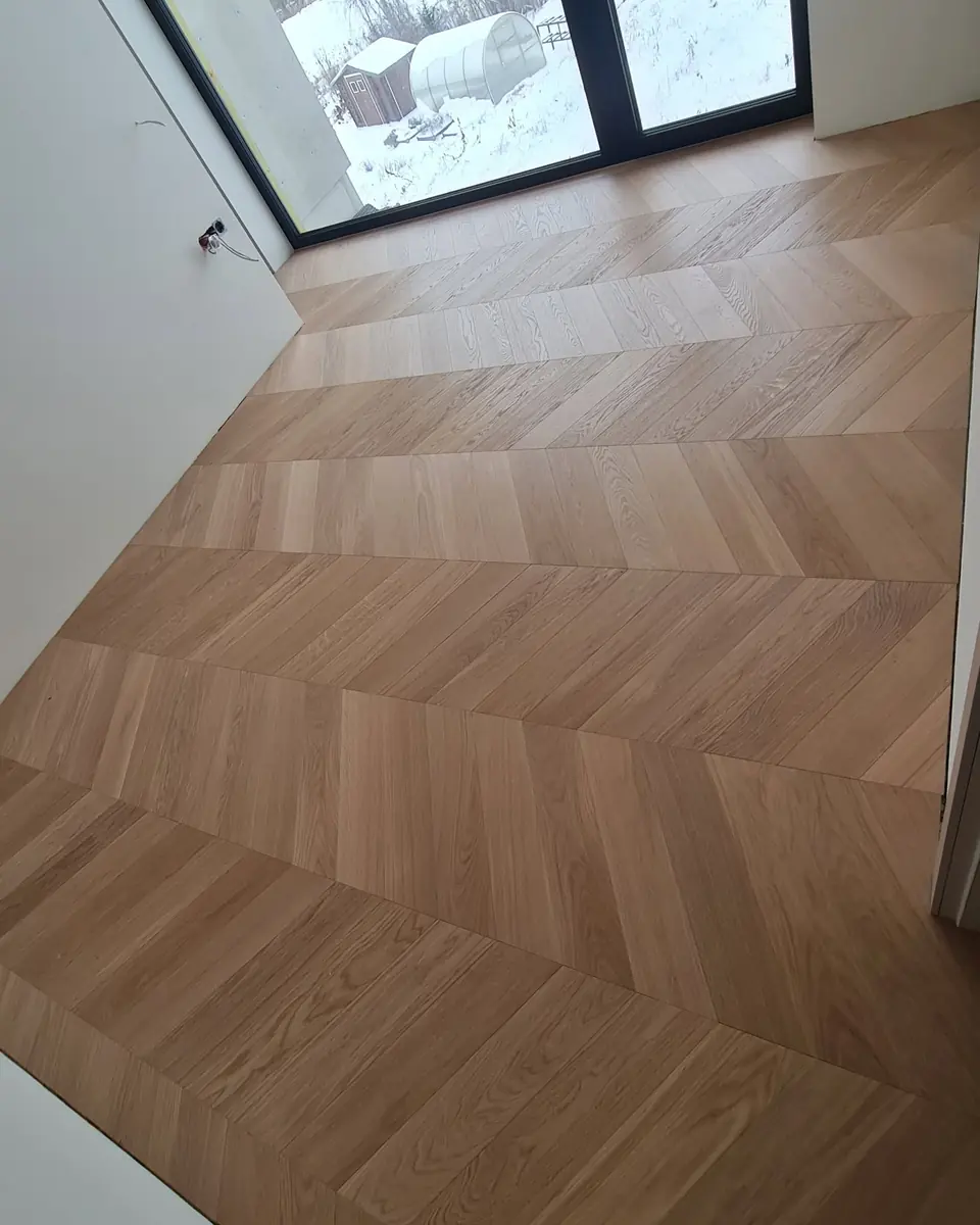 Oak boards beside a black framed window